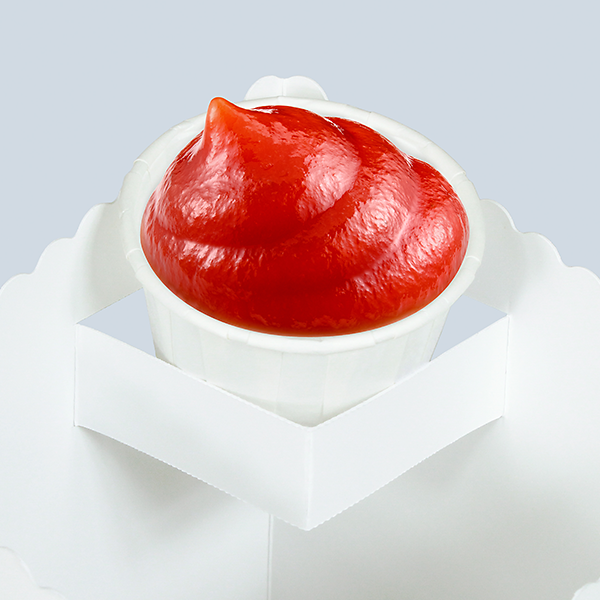 Coupelle de sauce placée dans le support d’une boîte alimentaire